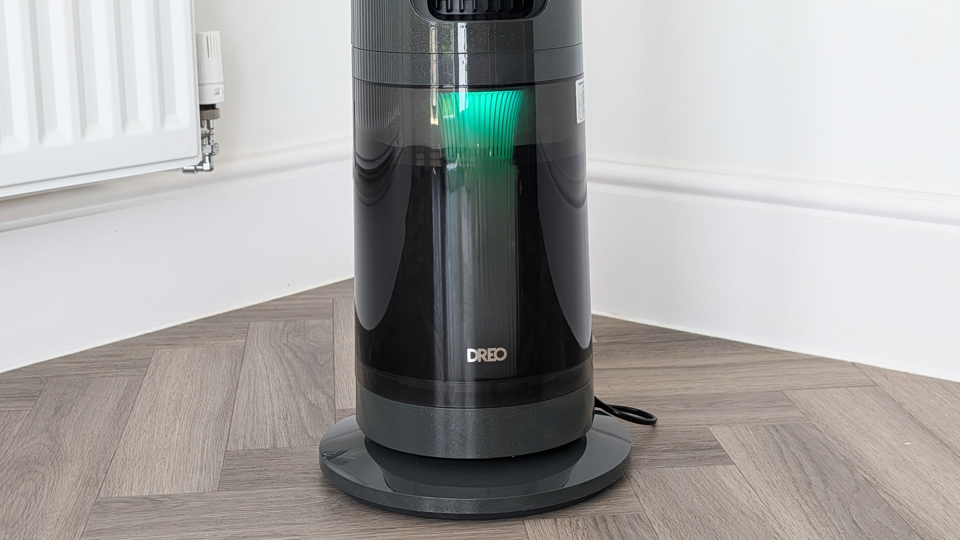 A closeup of the Dreo Smart Misting Fan 765S's water tank with a green light clearly visible.