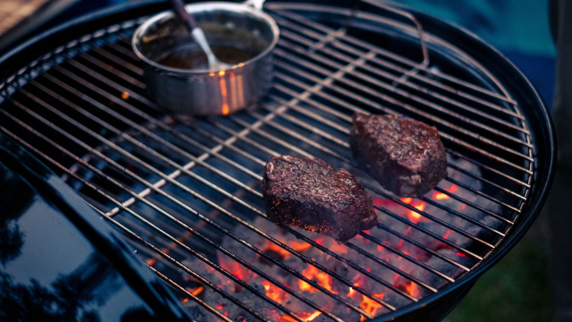 Dangerous viral heating hacks - two pieces of meat cooking on a BBQ