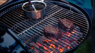 Dangerous viral heating hacks - two pieces of meat cooking on a BBQ