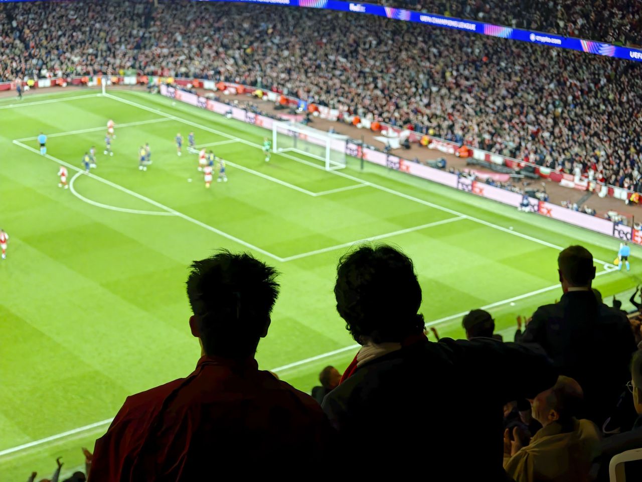 Action photos during a Champions League soccer match at Arsenal's Emirates stadium, taken with the Oppo Find X9 Ultra and teleconverter lens