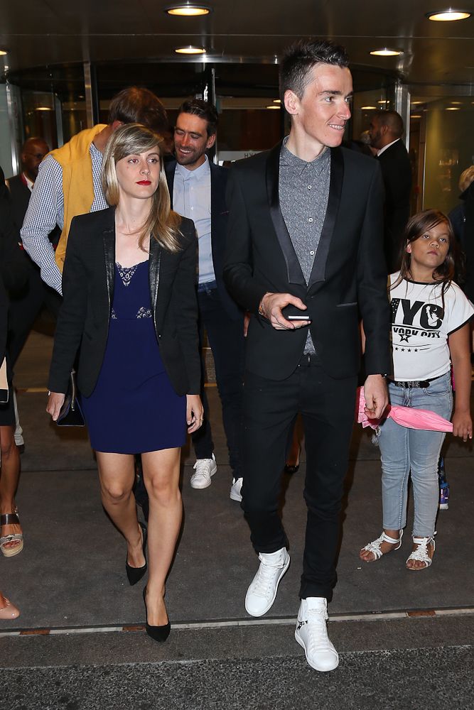 Romain Bardet and his girlfriend leave their hotel for the team's party following the 2015 Tour de France