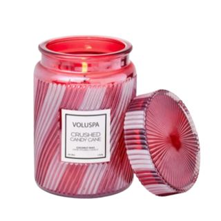 A red and white candy cane candle jar