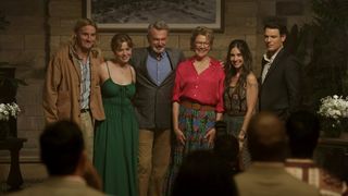 Conor Merrigan-Turner as Logan, Essie Randles as Brooke, Sam Neill as Stan, Annette Bening as Joy, Alison Brie as Amy and Jake Lacy as Troy huddled together in Apples Never Fall