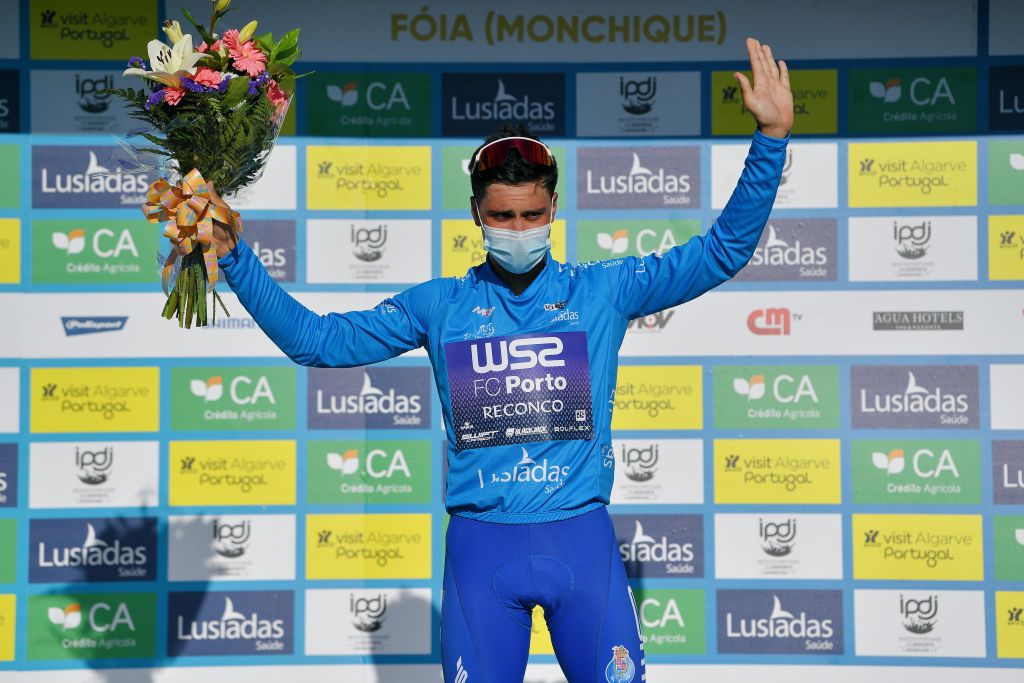FOIA PORTUGAL MAY 06 Joo Rodrigues of Portugal and Team W52Fc Porto blue mountain jersey celebrates at podium during the 47th Volta Ao Algarve 2021 Stage 2 a 1828km stage from Sagres to Fia 890m Mask Covid safety measures VoltAlgarve VAlgarve2021 on May 06 2021 in Fia Portugal Photo by Luc ClaessenGetty Images