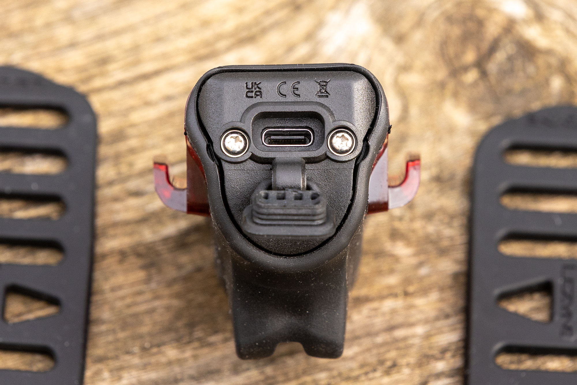 USB-C port, situated at the base of the unit, sealed with a rubber bung