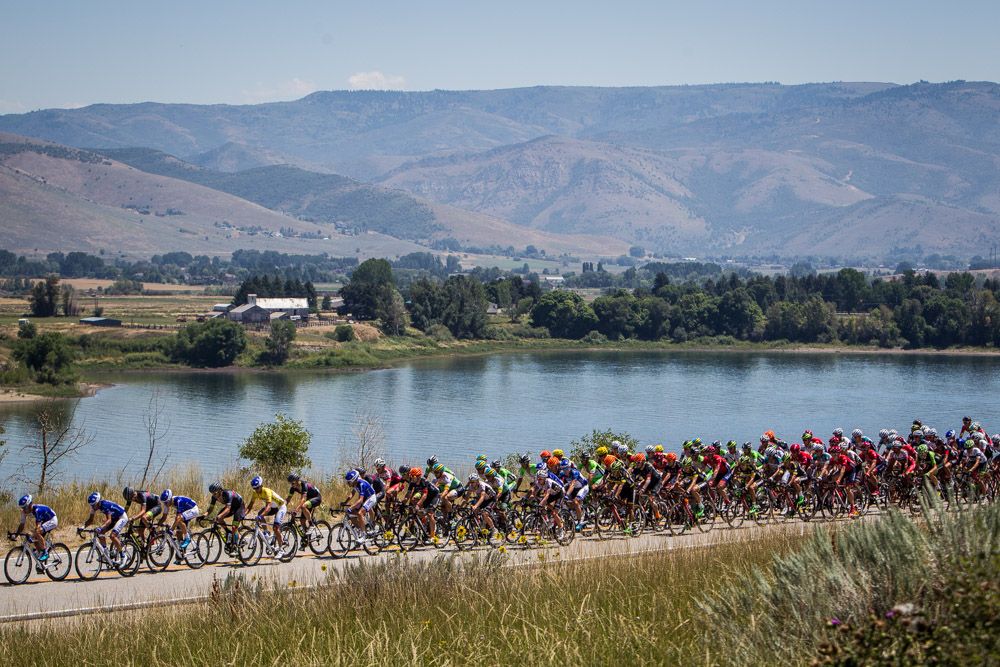 The peloton passes by Pine View Reservoir before hitting the climb.