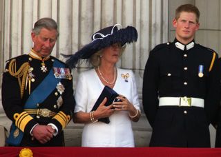 King Charles and Camilla Queen Consort stood on the balcony of Buckingham Palace with Prince Harry
