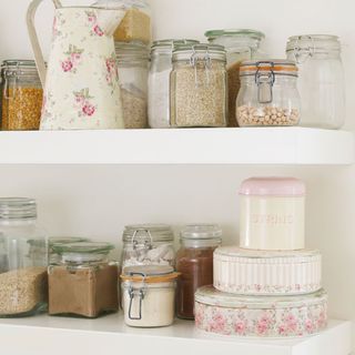 white shelves with storage and kitchen spices