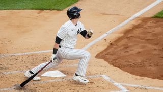 Billy McKinney #57 of the New York Yankees hits a single during a game against the Boston Red Sox at Yankee Stadium