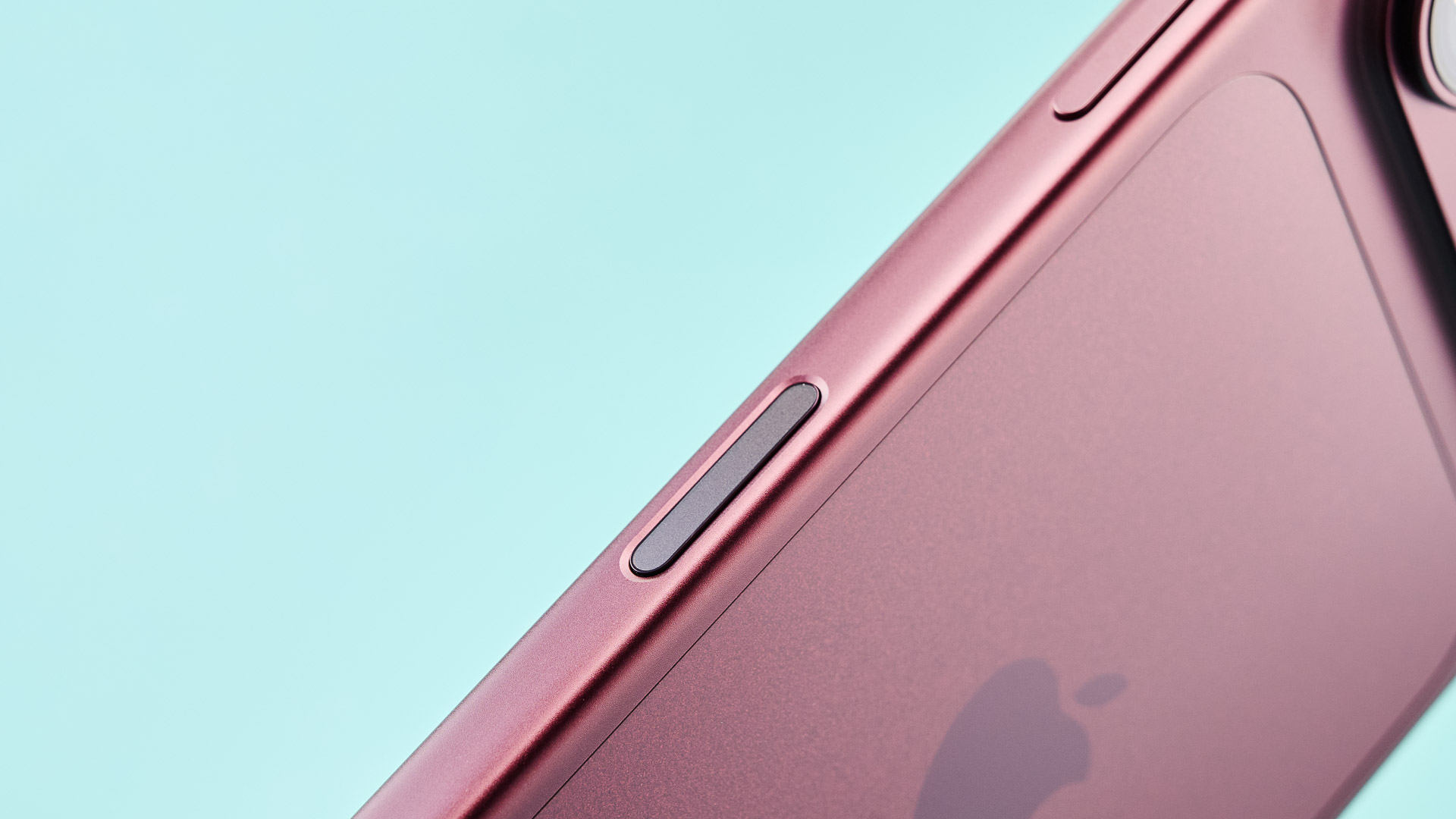 Apple iPhone 18 Pro in burgundy on green background