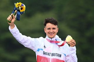 Britains Thomas Pidcock celebrates after winning the gold medal at the medal ceremony of the cycling mountain bike mens crosscountry event during the Tokyo 2020 Olympic Games at the Izu MTB Course in Izu on July 26 2021 Photo by GREG BAKER AFP Photo by GREG BAKERAFP via Getty Images