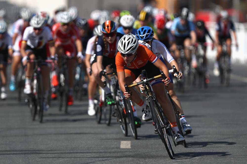A rider from the Netherlands leads the junior women peloton