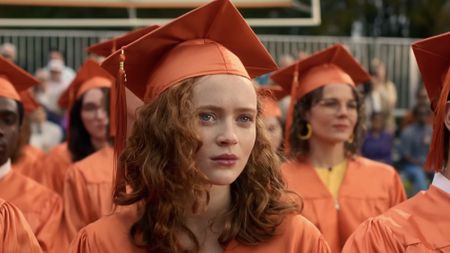 Sink wearing a graduation robe in the Stranger Things finale