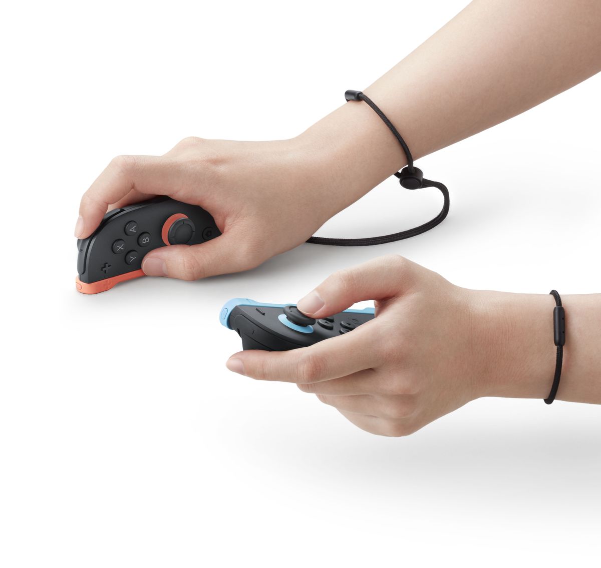 Nintendo Switch 2 vs Switch OLED; hands uses a game controller in different ways