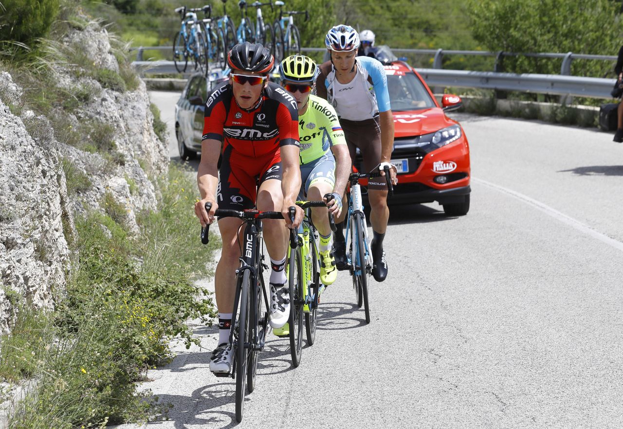The early three-man break make their way up the first climb