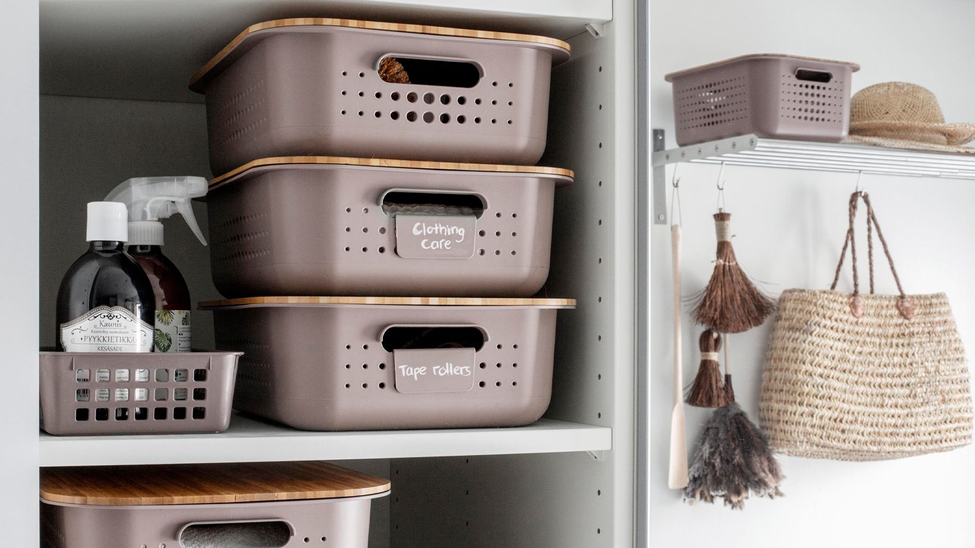 stacked laundry storage containers with lids and labels