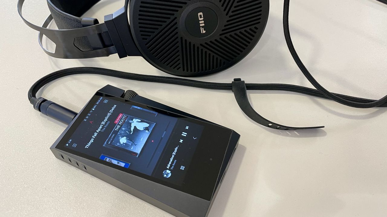 Astell &amp; Kern A&amp;norma SR35 and FiiO FT5 on a white table