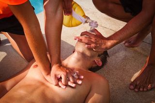 drowning man receiving cpr