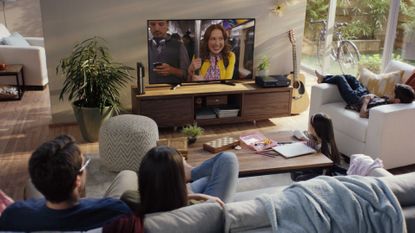 Best streaming service UK: Netflix on TV in living room with family watching
