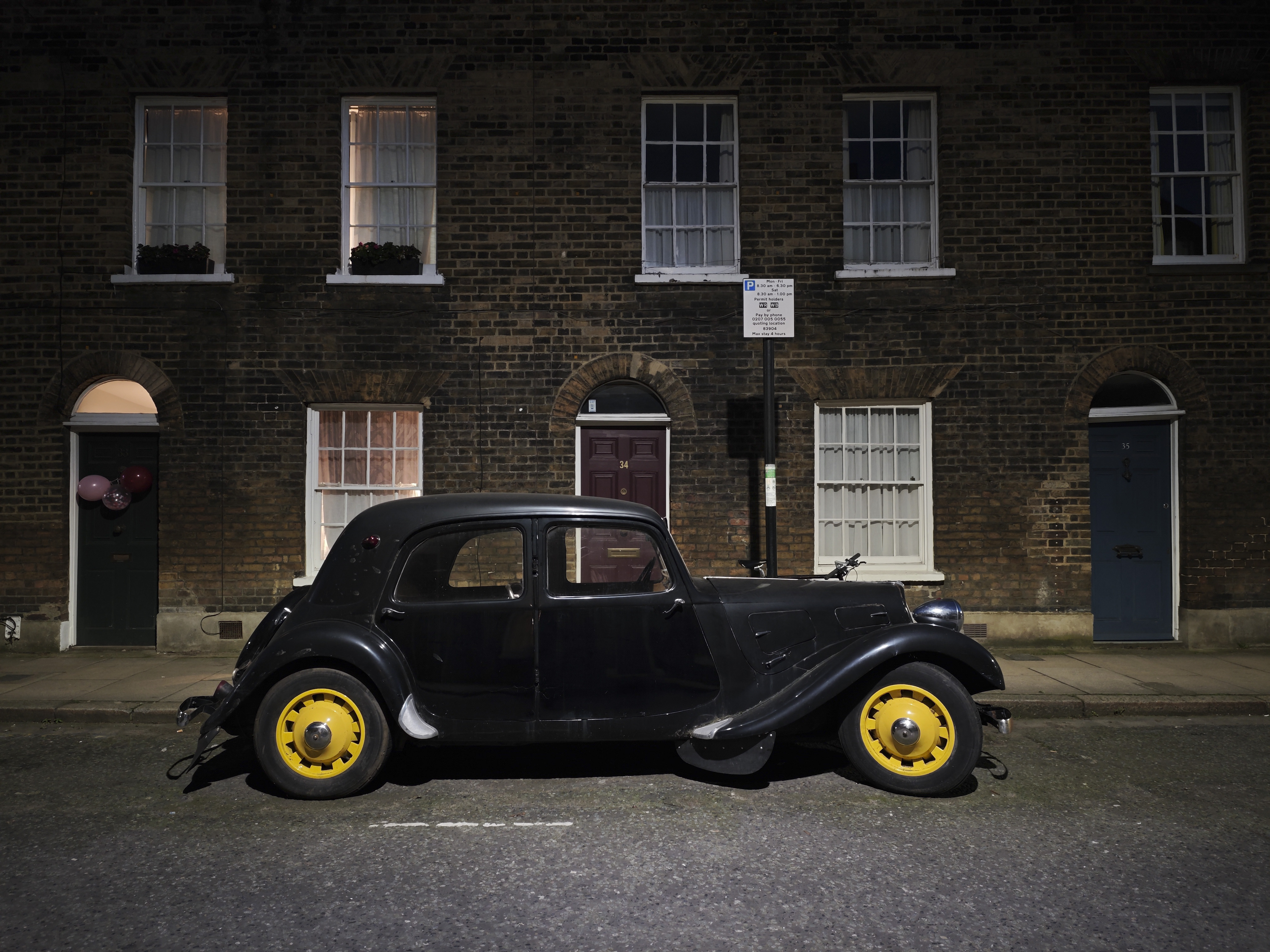 Xiaomi 15 Ultra sample photos; vintage car in old London street at night