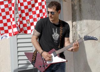 Croatia coach Slaven Bilic plays the guitar in Split in April 2008.