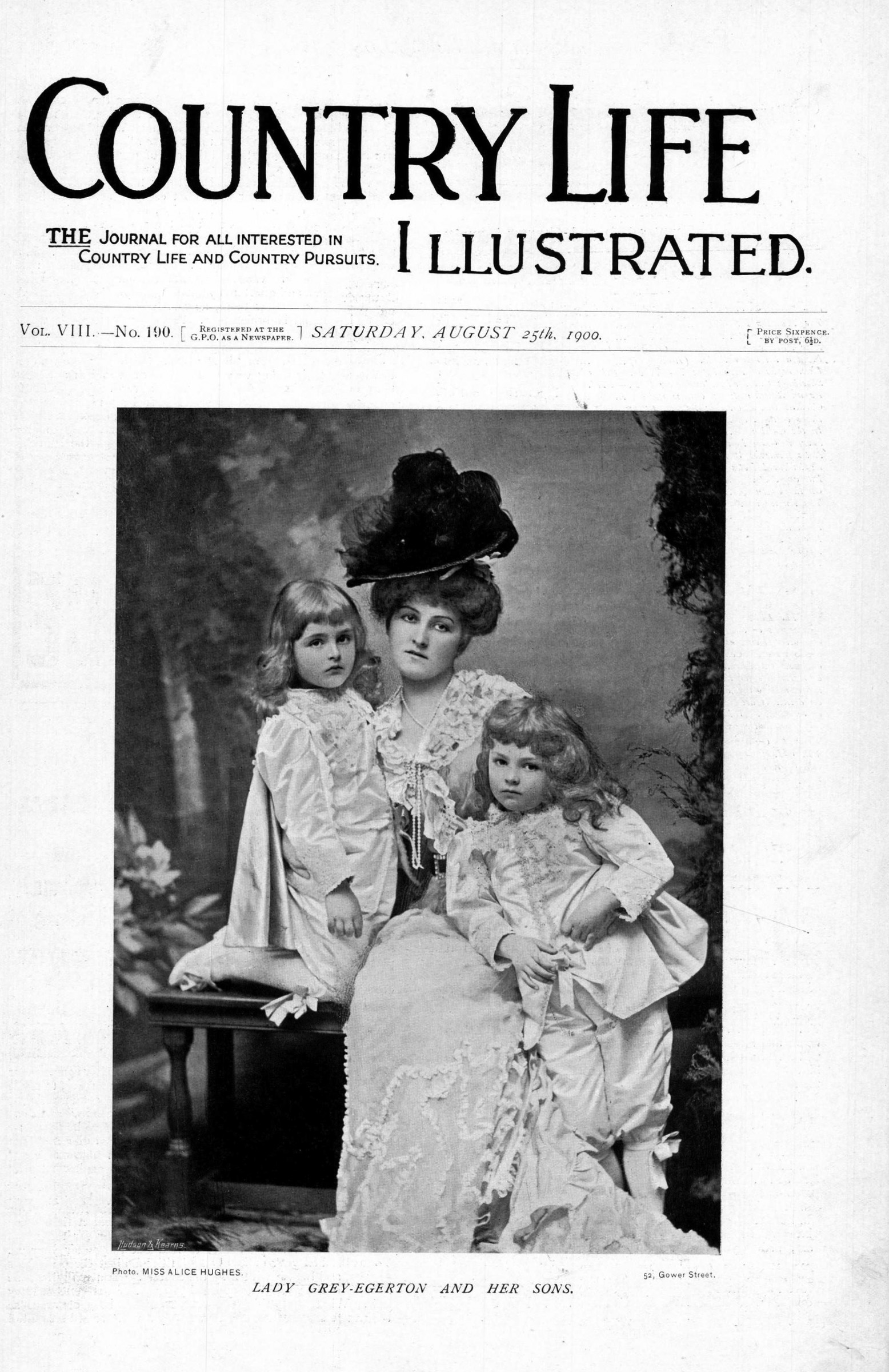 Black-and-white portrait of Lady Grey-Egerton and sons on the Country Life Frontispiece page. The three are in Regency-style fancy dress