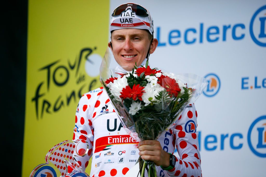 LIBOURNE FRANCE JULY 16 Tadej Pogaar of Slovenia and UAETeam Emirates Polka Dot Mountain Jersey celebrates at podium during the 108th Tour de France 2021 Stage 19 a 207km stage from Mourenx to Libourne LeTour TDF2021 on July 16 2021 in Libourne France Photo by Chris GraythenGetty Images