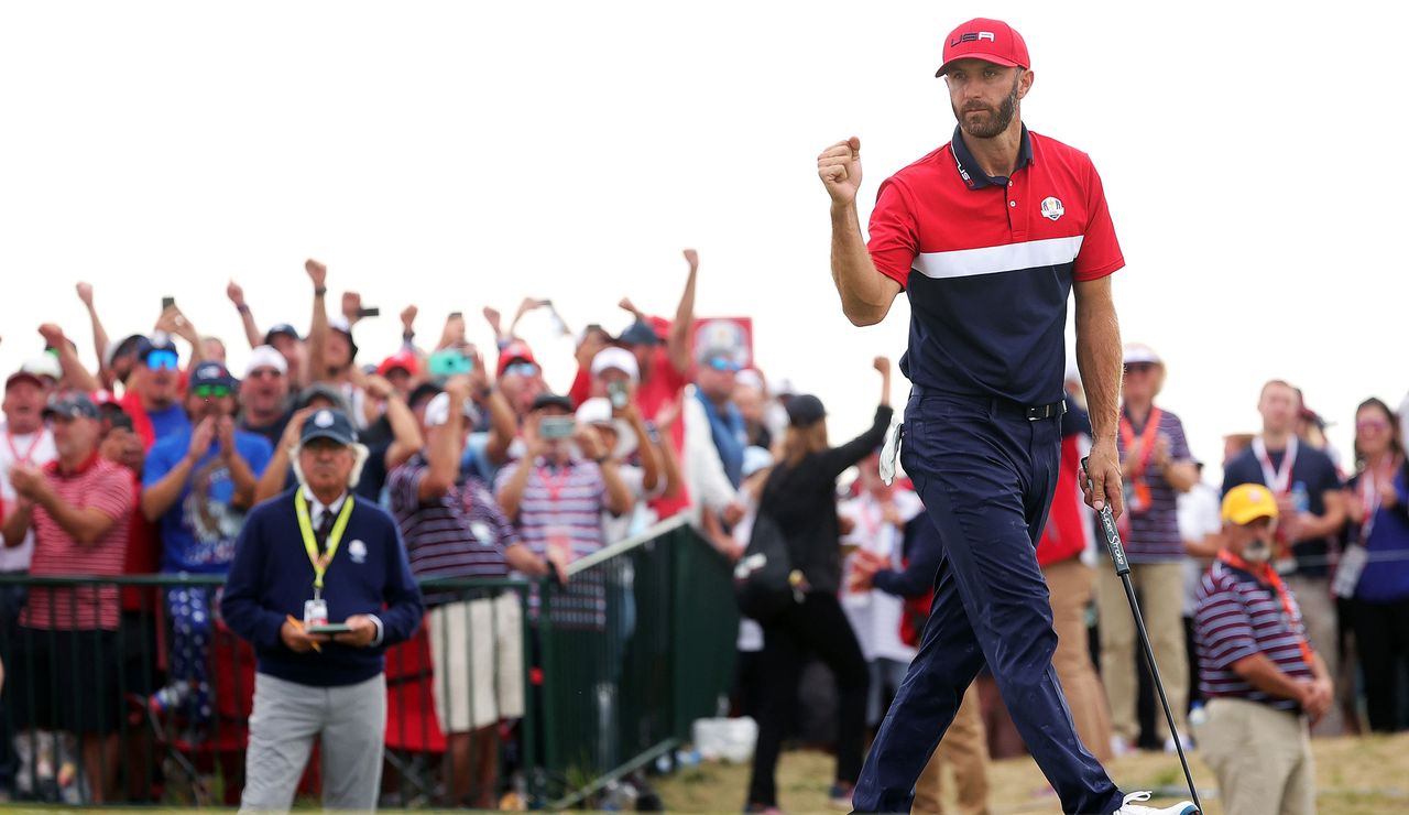 Dustin Johnson fist pumps after holing the winning putt in his match