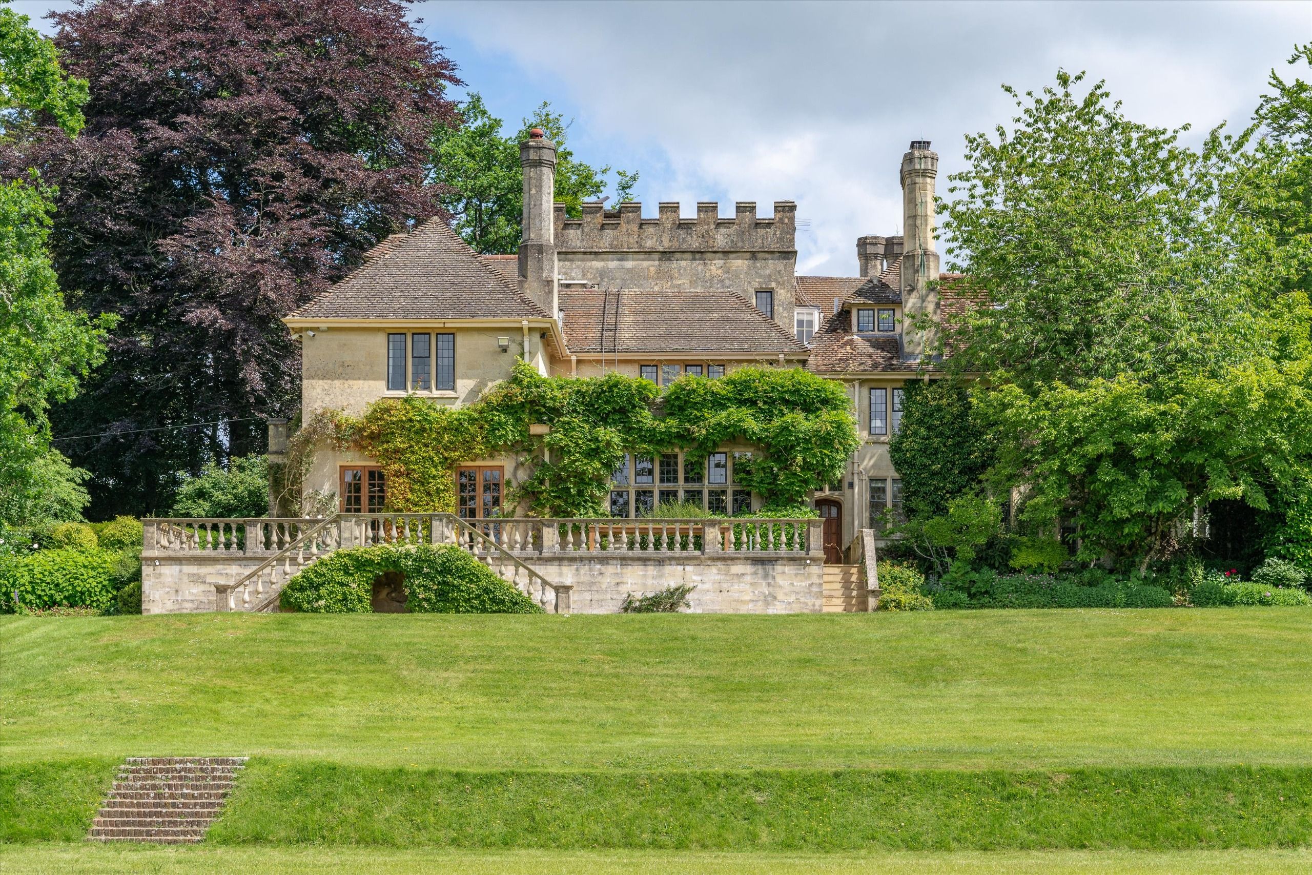 Six outstanding homes, from an Elizabethan farmhouse to a miniature castle in Sussex, as seen in Country Life