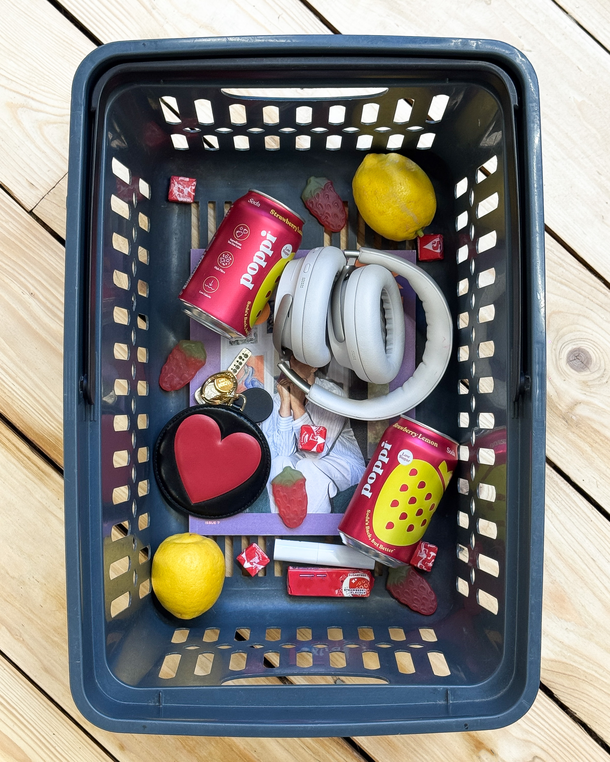 a basket with poppi sodas