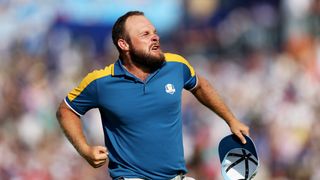 Tyrrell Hatton celebrates winning his Ryder Cup singles match