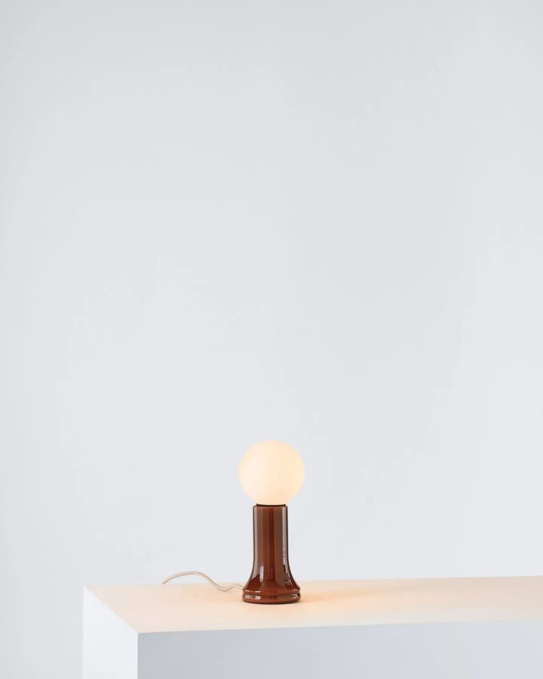 Shore Table Lamp against white-washed wall.