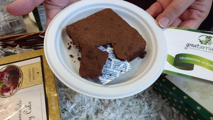 This brownie cake from GreatArrivals.com had part of the packing material stuck inside the cake.