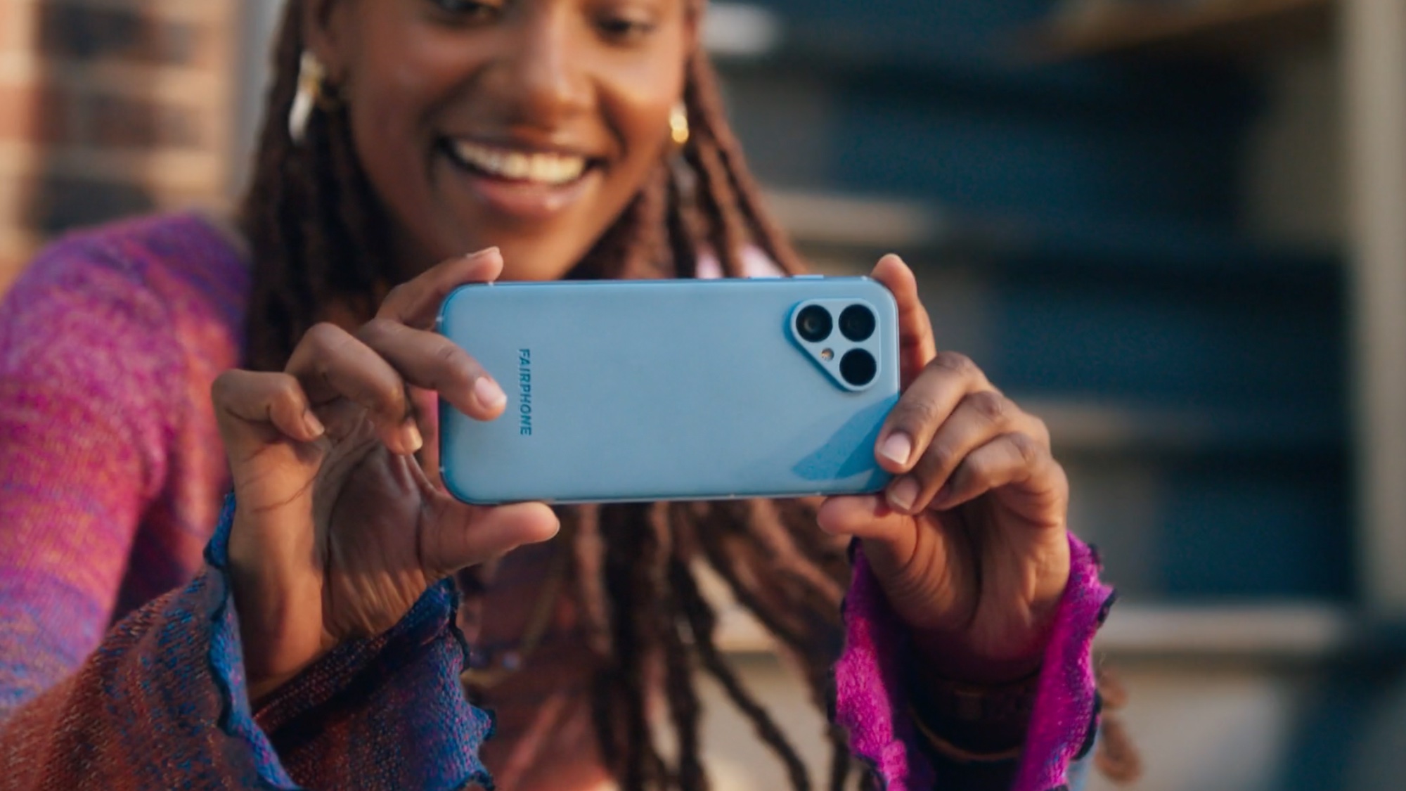 Fairphone 5 cameras being used by woman