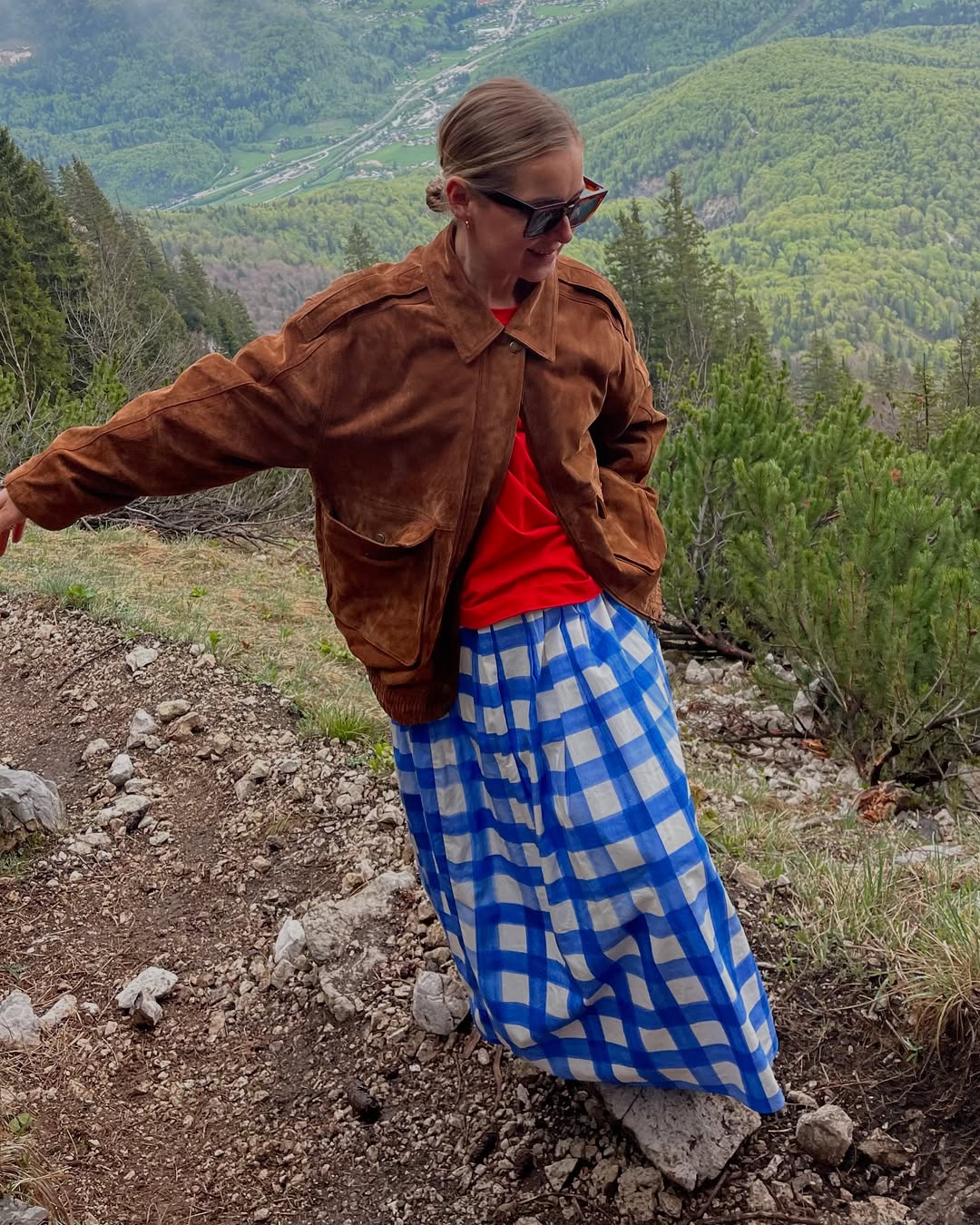 Anna Borisovna wears blue checked skirt suede jacket
