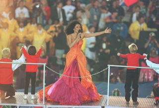 Pop artist Diana Ross performs on-stage during half-time of the Dallas Cowboys game versus the Pittsburgh Steelers in Super Bowl XXX at Sun Devil Stadium in Tempe, Arizona. The Cowboys defeated the Steelers 27-17 to win the Super Bowl.