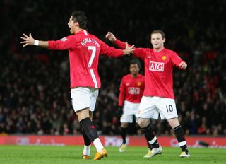 Cristiano Ronaldo and Wayne Rooney celebrate after the portuguese scores from a free-kick for Manchester United against Portsmouth in 2008.