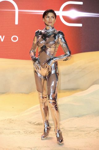 Zendaya attends the World Premiere of Dune: Part Two in London wearing a Thierry Mugler cyborg suit.