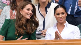 Catherine, Duchess of Cambridge and Meghan, Duchess of Sussex in the Royal Box on Centre Court