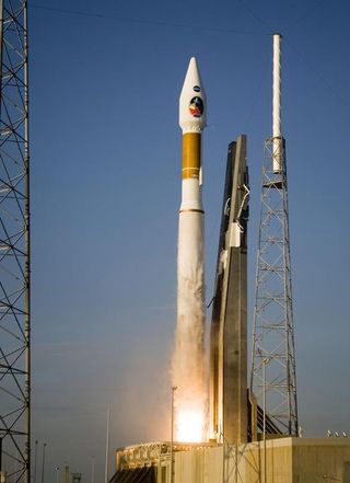 An Atlas V launch vehicle, 19 stories tall, with a two-ton Mars Reconnaissance Orbiter (MRO) on top, lifts off the pad on Launch Complex 41 at Cape Canaveral Air Force Station in Florida.