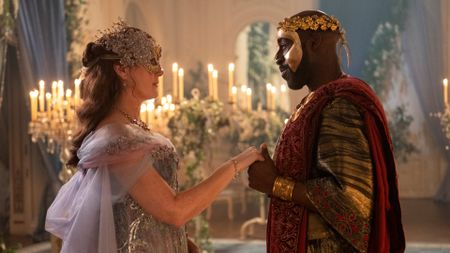 Ruth Gemmell as Lady Violet Bridgerton, Daniel Francis as Lord Anderson in Bridgerton season 4, dancing. 