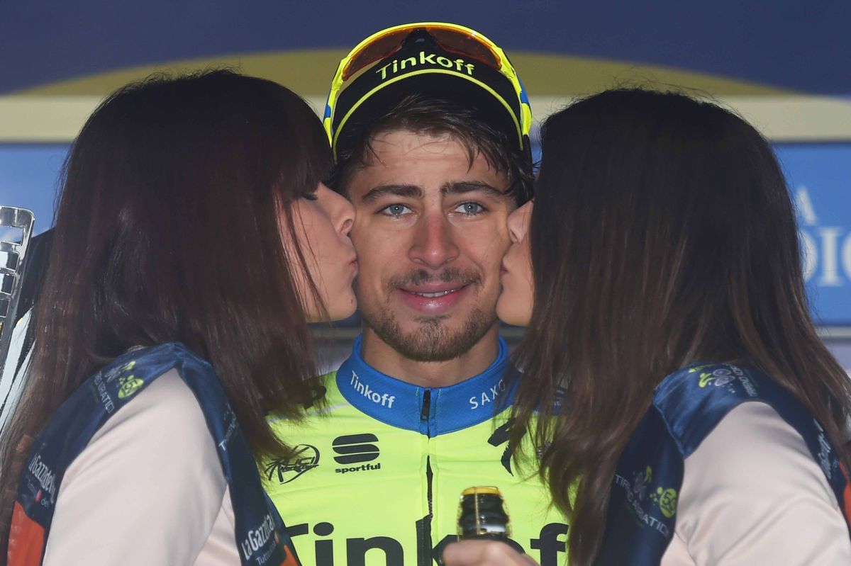 Peter Sagan receiving kisses from the podium hostesses