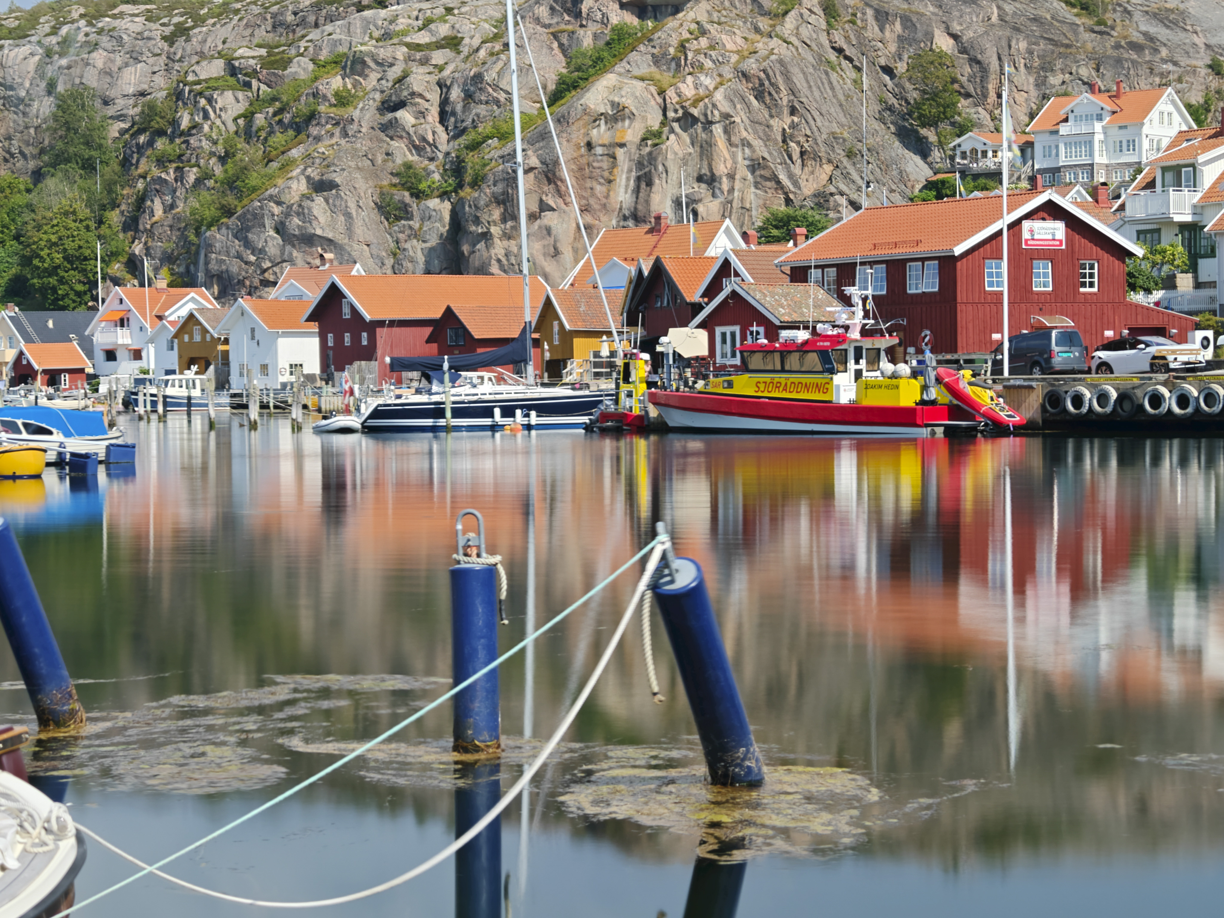 Oppo Find X8 Ultra phone sample image: bright colored fishing huts over still water