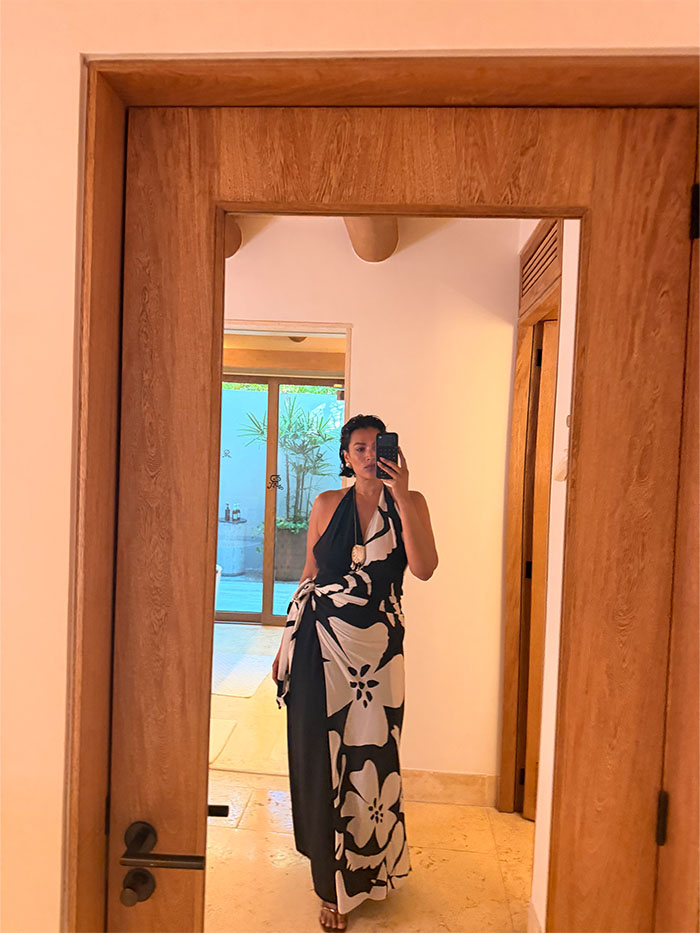 Jennifer Atilemile wearing a vacation outfit.