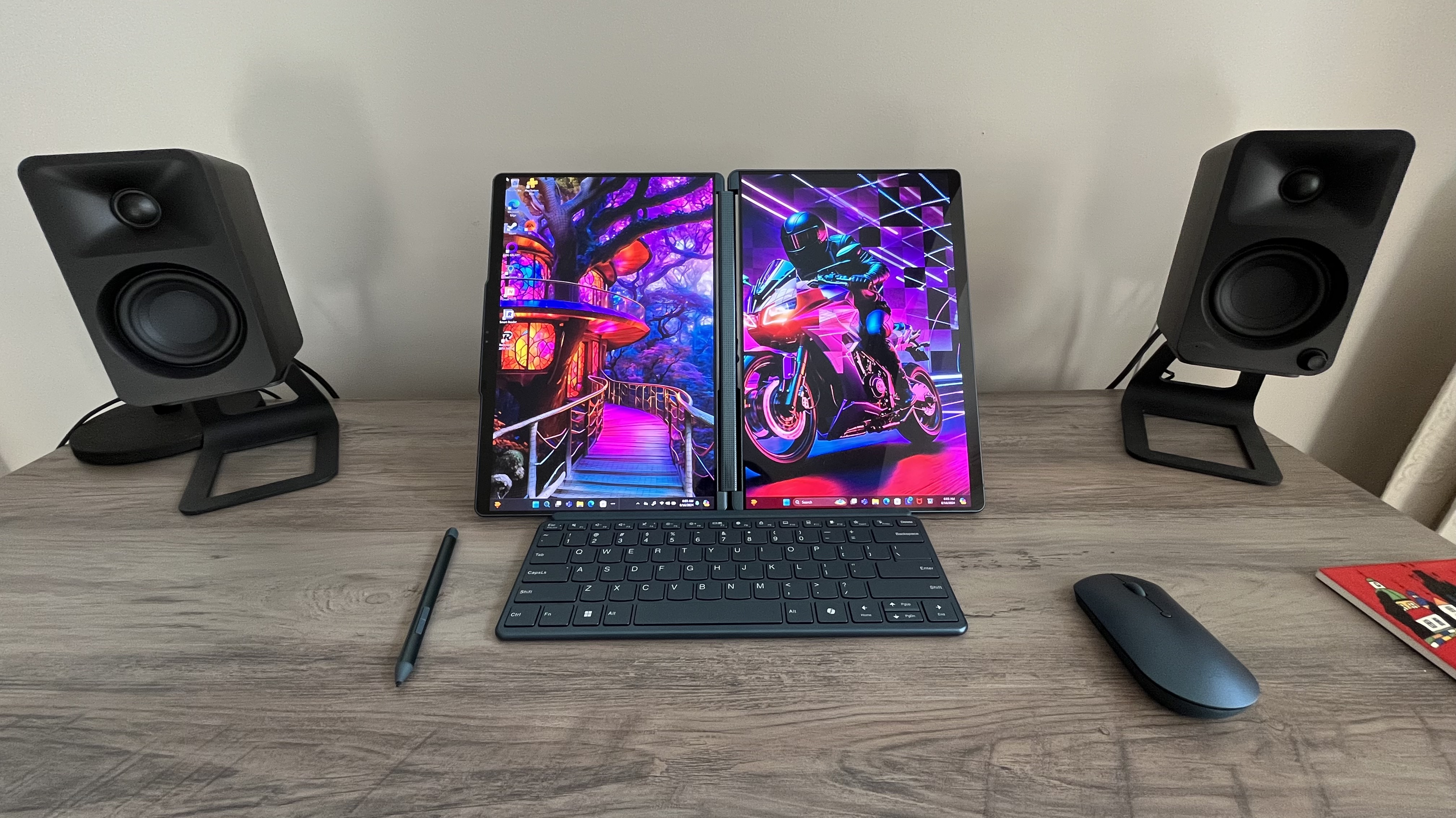 Lenovo Yoga Book 9i laptop in portrait mode, with one monitor next to the other