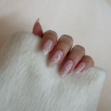 A close-up of lace nail art