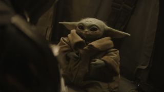 Grogu listening to Mand on the Razorback 