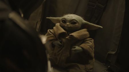 Grogu listening to Mand on the Razorback 