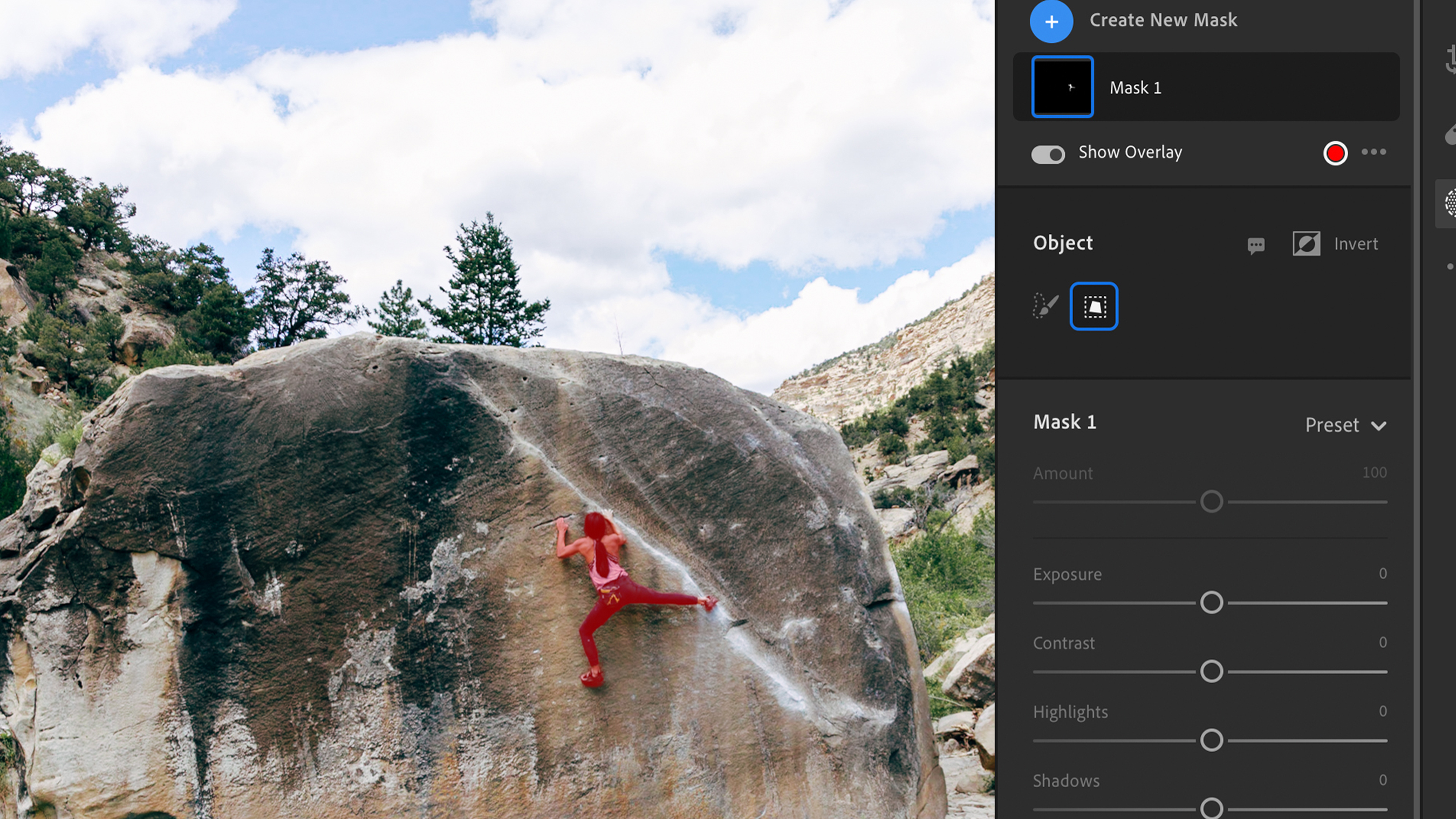A person climbing a rock in Adobe Lightroom