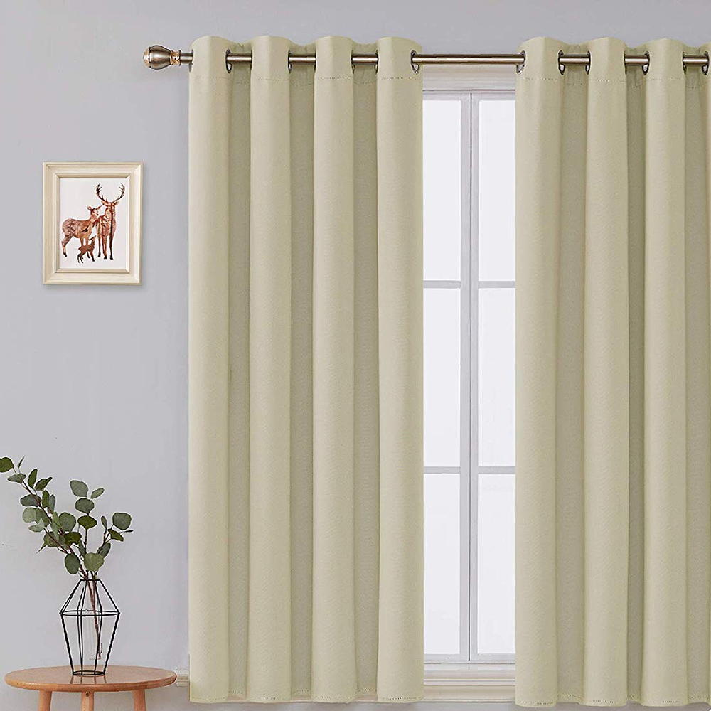 room with white wall and white window with curtain and sidetable